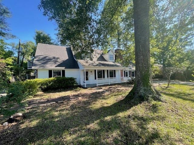 14151 W Hoffman Rd, Hammond, LA 70403 - view of front of property with a porch and a front yard