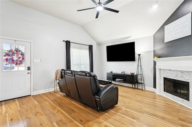 2311 Jay St, Slidell, LA 70460 - living room with lofted ceiling, ceiling fan, light wood-style floors, and a fireplace
