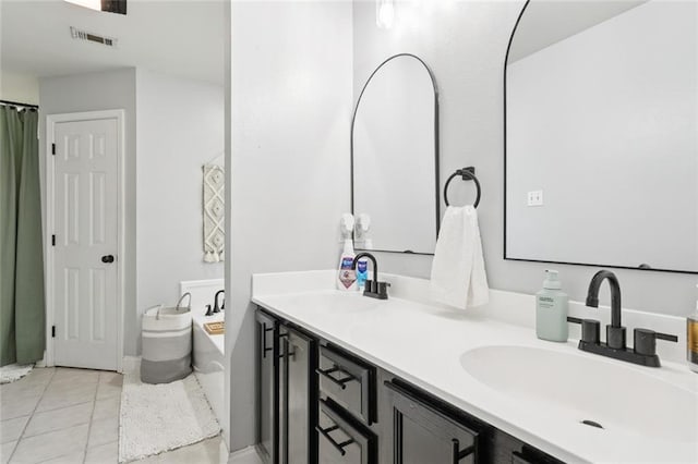 2311 Jay St, Slidell, LA 70460 - full bathroom featuring double vanity, a bath, and tile patterned flooring