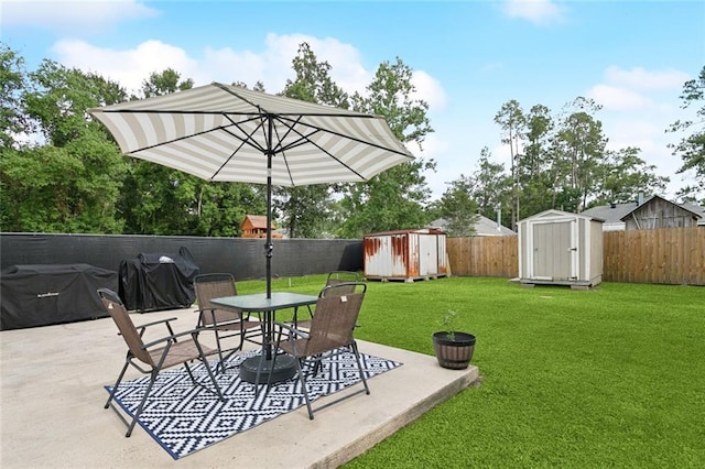 2311 Jay St, Slidell, LA 70460 - fenced backyard with a storage unit, a patio, grilling area, and outdoor dining space