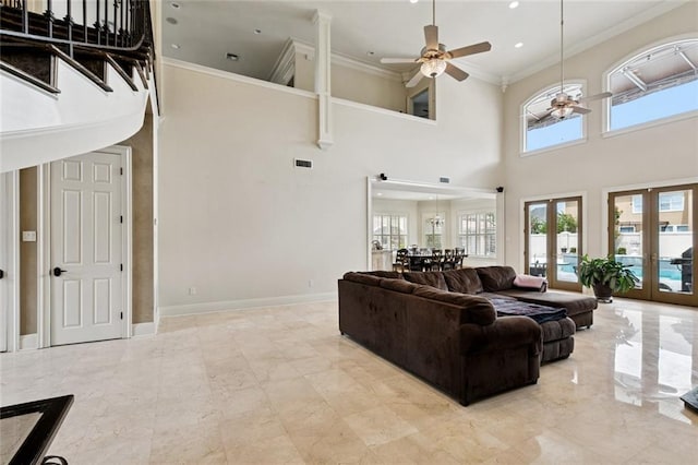 154 Primrose Dr, Belle Chasse, LA 70037 - living area featuring french doors, a towering ceiling, ceiling fan, healthy amount of natural light, and crown molding