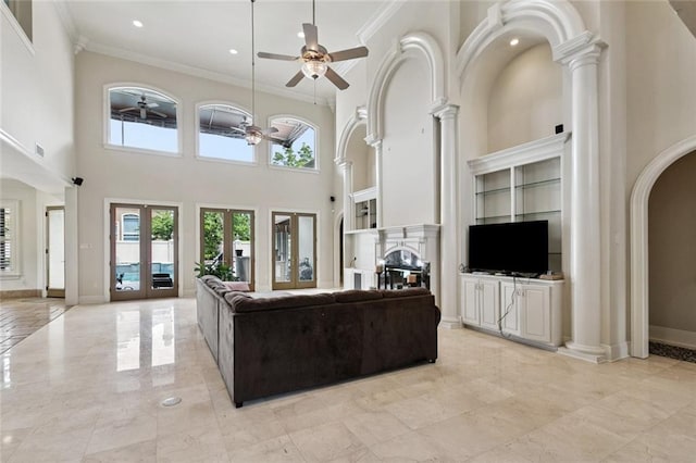 154 Primrose Dr, Belle Chasse, LA 70037 - living area with a ceiling fan, crown molding, arched walkways, a high ceiling, and recessed lighting