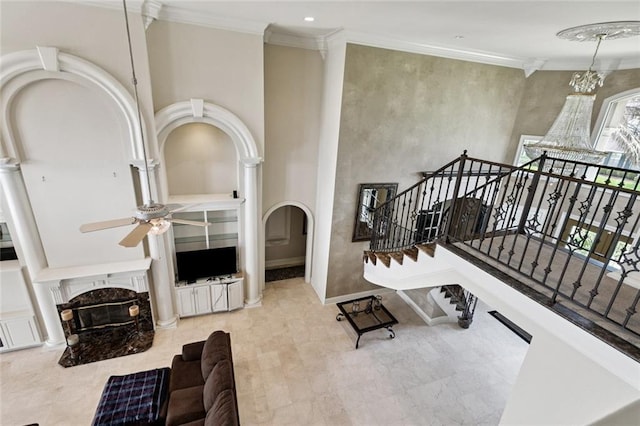 154 Primrose Dr, Belle Chasse, LA 70037 - living area featuring ceiling fan, a fireplace, crown molding, arched walkways, and recessed lighting