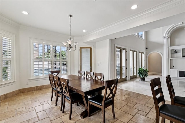154 Primrose Dr, Belle Chasse, LA 70037 - dining space with a chandelier, stone tile flooring, crown molding, and recessed lighting
