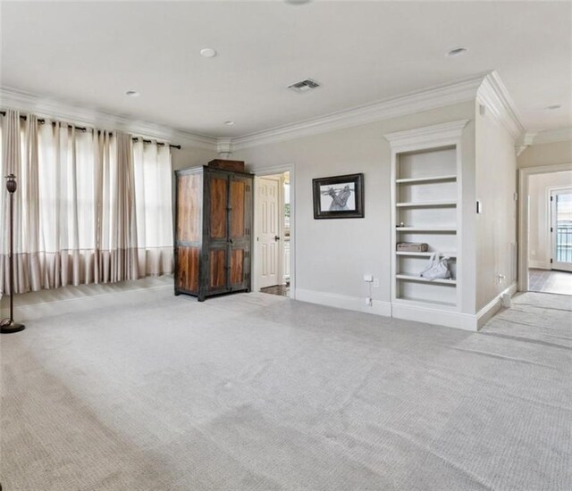 154 Primrose Dr, Belle Chasse, LA 70037 - unfurnished living room with carpet, crown molding, and built in features