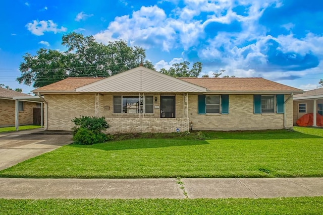 4213 Purdue Dr, Metairie, LA 70003 - ranch-style house with a front yard, brick siding, and driveway