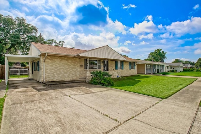 4213 Purdue Dr, Metairie, LA 70003 - ranch-style house featuring concrete driveway, brick siding, and a carport