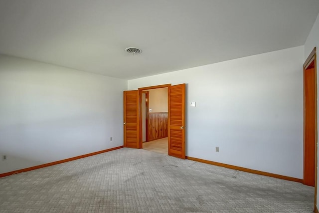 4213 Purdue Dr, Metairie, LA 70003 - spare room featuring baseboards and light carpet