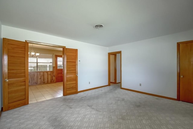 4213 Purdue Dr, Metairie, LA 70003 - unfurnished room with carpet flooring and a chandelier