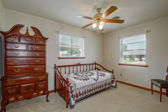 4213 Purdue Dr, Metairie, LA 70003 - bedroom featuring light colored carpet, multiple windows, and ceiling fan