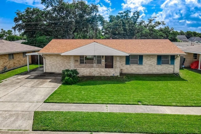 4213 Purdue Dr, Metairie, LA 70003 - ranch-style home featuring a front yard, driveway, brick siding, and roof with shingles