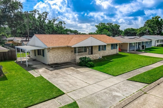 4213 Purdue Dr, Metairie, LA 70003 - ranch-style home with concrete driveway, brick siding, a shingled roof, a carport, and roof mounted solar panels