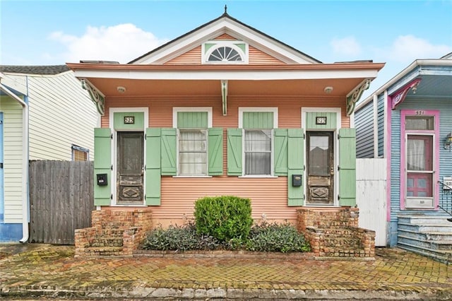 523-25 Spain St, New Orleans, LA 70117 - shotgun-style home featuring entry steps and a porch