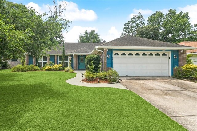 1605 Rue Lemans, Slidell, LA 70458 - ranch-style house featuring brick siding, concrete driveway, a garage, and a front yard