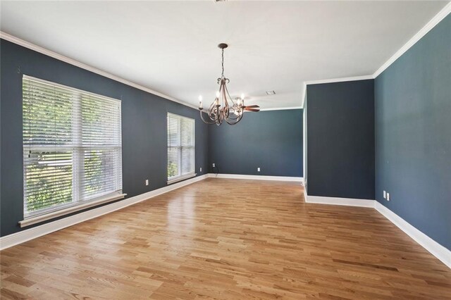 1605 Rue Lemans, Slidell, LA 70458 - spare room with a chandelier, crown molding, and light wood finished floors