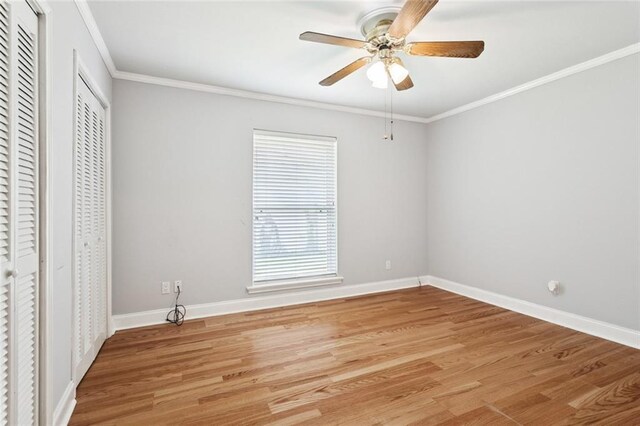 1605 Rue Lemans, Slidell, LA 70458 - unfurnished bedroom with ornamental molding, light wood finished floors, and ceiling fan