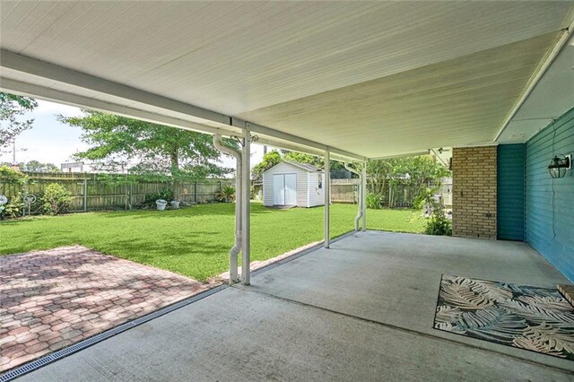 1605 Rue Lemans, Slidell, LA 70458 - fenced backyard featuring a patio area and a shed