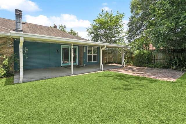 1605 Rue Lemans, Slidell, LA 70458 - rear view of property with a patio area, roof with shingles, and brick siding