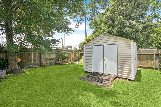 1605 Rue Lemans, Slidell, LA 70458 - view of shed featuring a fenced backyard