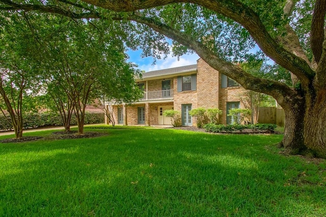 8808 Chretien Point Pl, River Ridge, LA 70123 - view of front of house featuring a balcony and brick siding