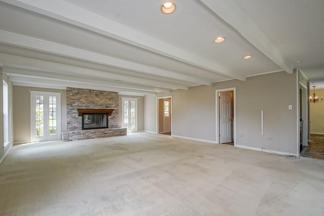 8808 Chretien Point Pl, River Ridge, LA 70123 - unfurnished living room with healthy amount of natural light, carpet, beamed ceiling, a fireplace, and a chandelier