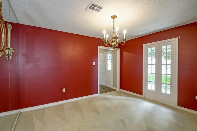 8808 Chretien Point Pl, River Ridge, LA 70123 - unfurnished dining area featuring a chandelier, carpet flooring, and a textured ceiling