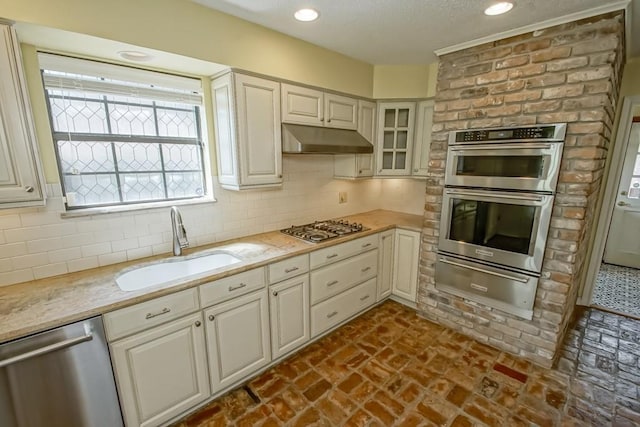8808 Chretien Point Pl, River Ridge, LA 70123 - kitchen featuring a warming drawer, stainless steel appliances, under cabinet range hood, decorative backsplash, and recessed lighting