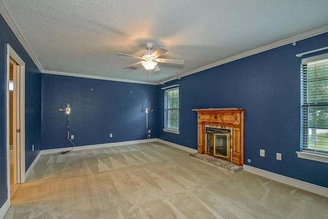 8808 Chretien Point Pl, River Ridge, LA 70123 - unfurnished living room with carpet floors, a ceiling fan, a glass covered fireplace, and crown molding