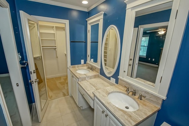 8808 Chretien Point Pl, River Ridge, LA 70123 - full bathroom with vanity, a walk in closet, tile patterned floors, crown molding, and a ceiling fan