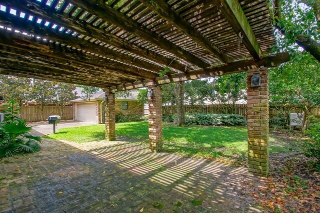 8808 Chretien Point Pl, River Ridge, LA 70123 - fenced backyard with a pergola, an outbuilding, a patio, and a garage