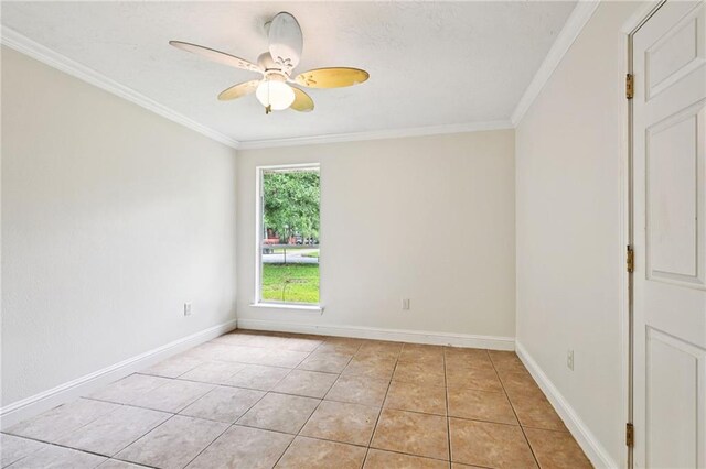 2142 Park Dr, Slidell, LA 70458 - spare room featuring ornamental molding, light tile patterned floors, and ceiling fan