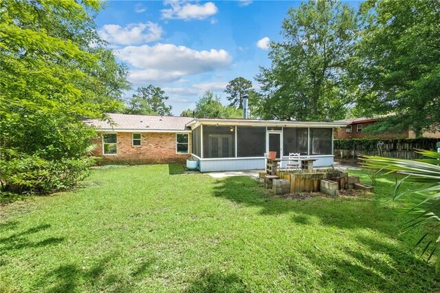 2142 Park Dr, Slidell, LA 70458 - rear view of house with a sunroom
