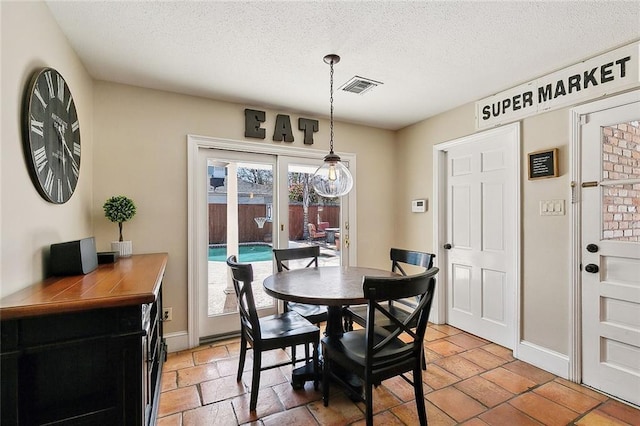 9408 Citrus Ln, River Ridge, LA 70123 - dining room with a textured ceiling