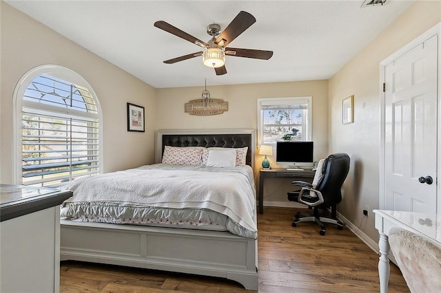 9408 Citrus Ln, River Ridge, LA 70123 - bedroom with wood finished floors, an office area, and ceiling fan