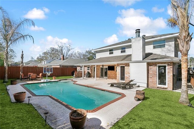 9408 Citrus Ln, River Ridge, LA 70123 - back of house with a fenced backyard, a patio, brick siding, a shingled roof, and a chimney