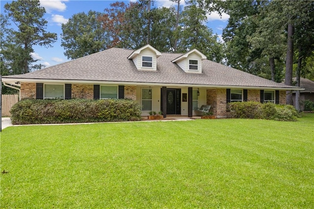426 Devon Dr, Mandeville, LA 70448 - view of front of home with brick siding, roof with shingles, and covered porch