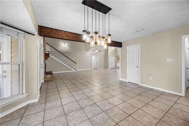 426 Devon Dr, Mandeville, LA 70448 - unfurnished living room featuring light tile patterned floors, a chandelier, and stairway