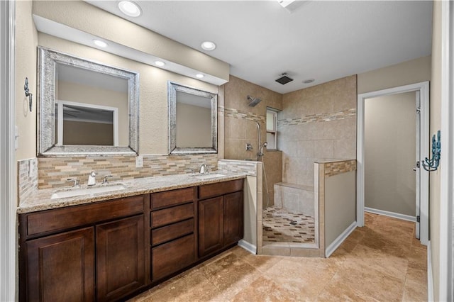 426 Devon Dr, Mandeville, LA 70448 - bathroom featuring walk in shower, double vanity, tasteful backsplash, recessed lighting, and tile patterned flooring