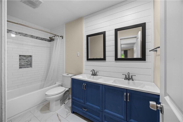 426 Devon Dr, Mandeville, LA 70448 - full bath featuring double vanity, shower / bath combo, and marble look tiles