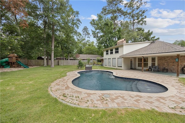 426 Devon Dr, Mandeville, LA 70448 - view of swimming pool with a patio and a playground
