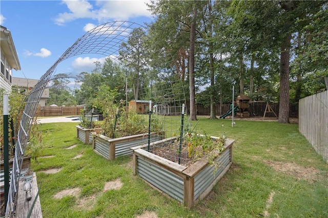 426 Devon Dr, Mandeville, LA 70448 - fenced backyard with a vegetable garden and a playground