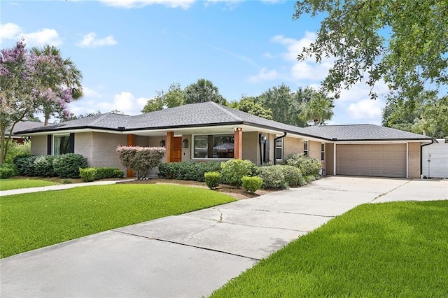 7320 General Haig St, New Orleans, LA 70124 - ranch-style house featuring a front yard, brick siding, a garage, and concrete driveway