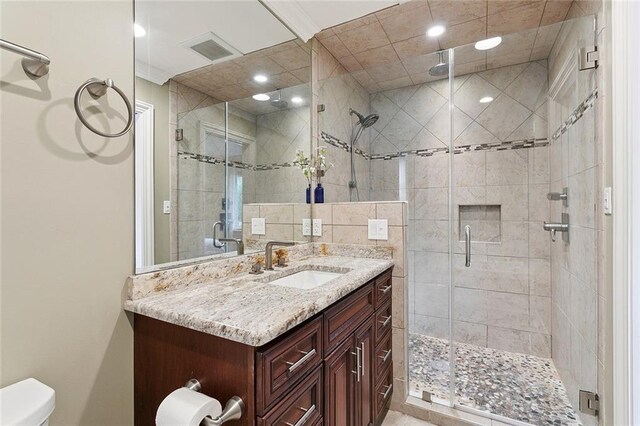 7320 General Haig St, New Orleans, LA 70124 - bathroom featuring vanity, a shower stall, and recessed lighting