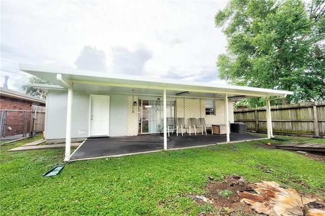 2808 Transcontinental Dr, Metairie, LA 70006 - rear view of house featuring brick siding and a patio