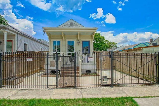 412 N Miro St, New Orleans, LA 70119 - shotgun-style home with a gate and a fenced front yard