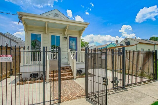 412 N Miro St, New Orleans, LA 70119 - shotgun-style home with a gate and a fenced front yard
