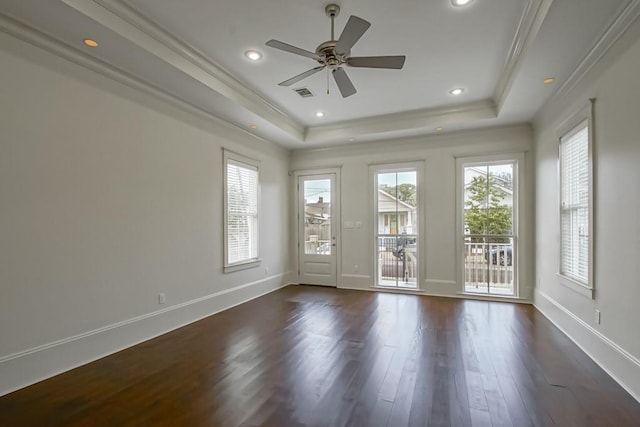 412 N Miro St, New Orleans, LA 70119 - empty room with a tray ceiling, dark wood finished floors, a ceiling fan, ornamental molding, and recessed lighting