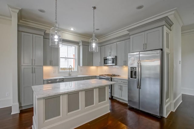 412 N Miro St, New Orleans, LA 70119 - kitchen with stainless steel appliances, gray cabinetry, ornamental molding, a kitchen island, and tasteful backsplash