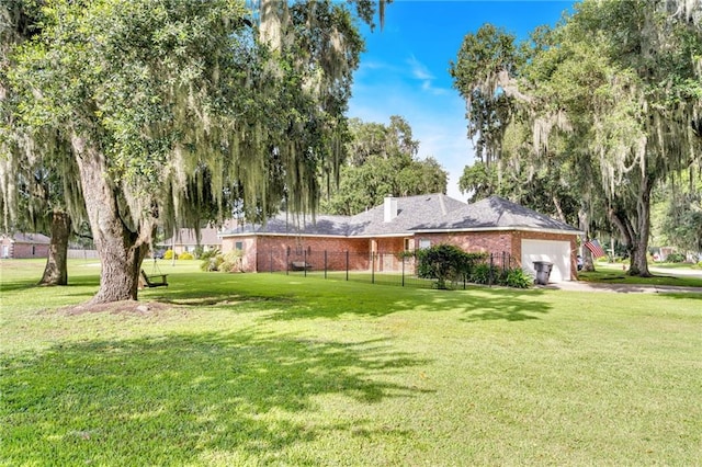 147 Jesuit Bend Dr, Belle Chasse, LA 70037 - view of grassy yard featuring a garage