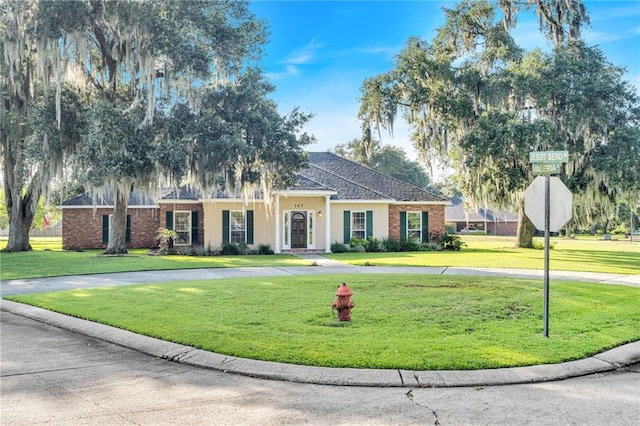 147 Jesuit Bend Dr, Belle Chasse, LA 70037 - view of front of home with a front yard